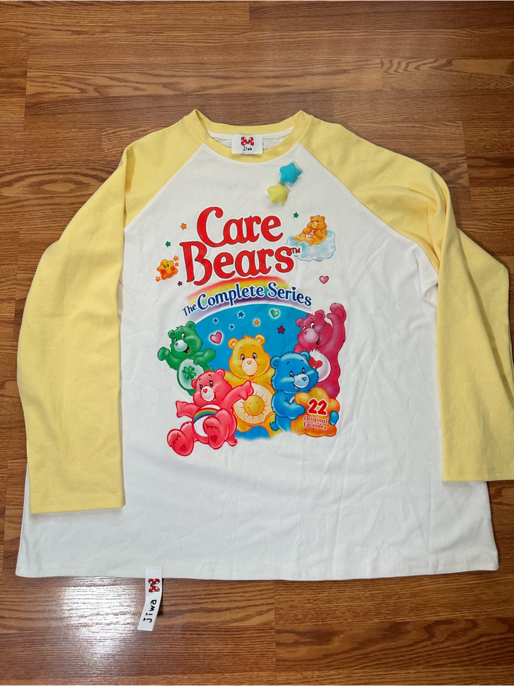 Care Bears White Tee with Yellow Raglan Sleeves and Multicolor Bear Graphic